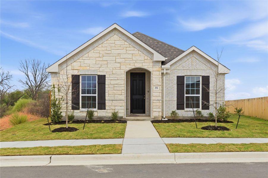 Front exterior of a new home in Infinity Square, Kyle, TX, highlighting curb appeal (Image 1). Front exterior of a new home in Infinity Square, Kyle, TX, highlighting curb appeal (Image 1).