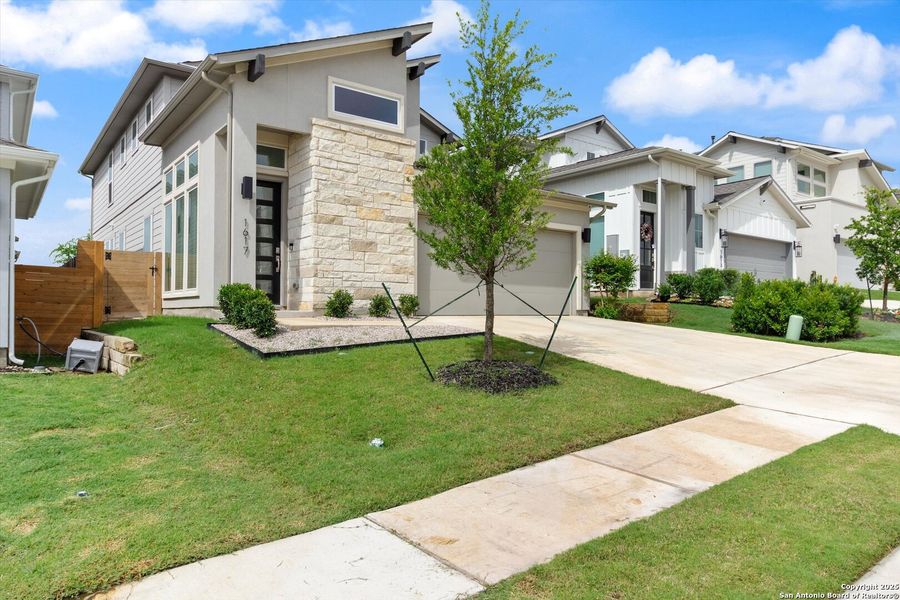 Front exterior of a new home in , Pflugerville, TX, highlighting curb appeal (Image 24).