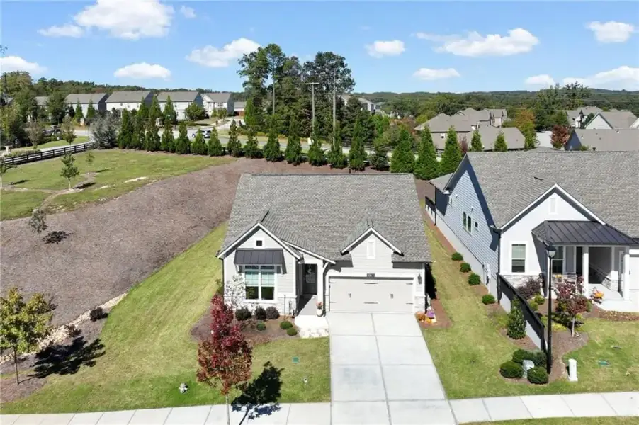 Front exterior of a new home in The Retreat at Sterling on the Lake 48', Flowery Branch, GA, highlighting curb appeal (Image 22).