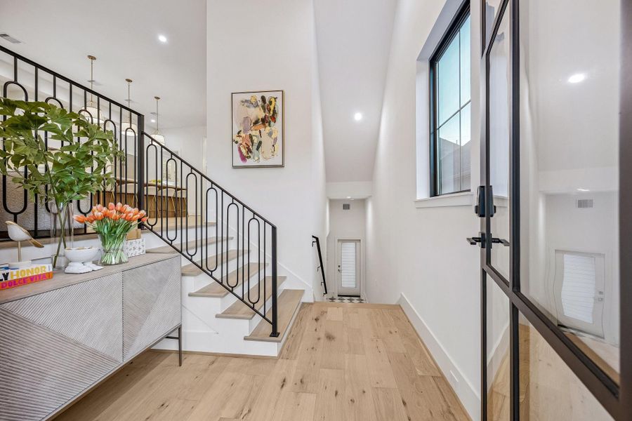 The entrance of the home makes a striking first impression with its clean, modern sophistication and airy scale. The entrance of the home makes a striking first impression with its clean, modern sophistication and airy scale.