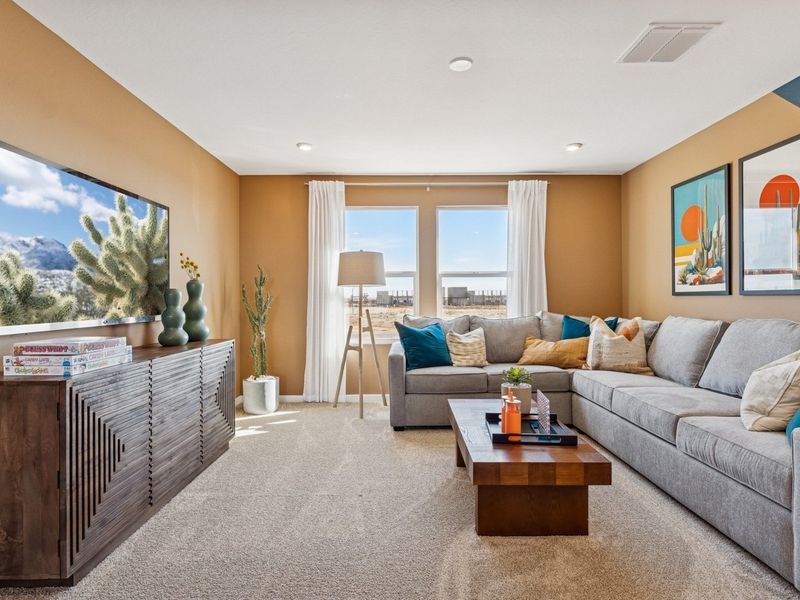 A living room with a couch and a coffee table. A living room with a couch and a coffee table.