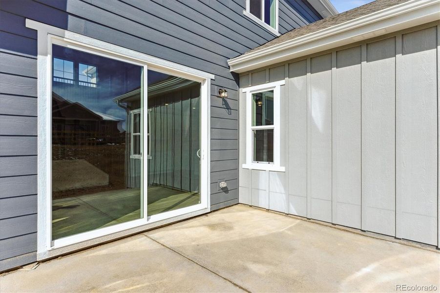 Front exterior of a new home in Trails at Smoky Hill, Parker, CO, highlighting curb appeal (Image 1).