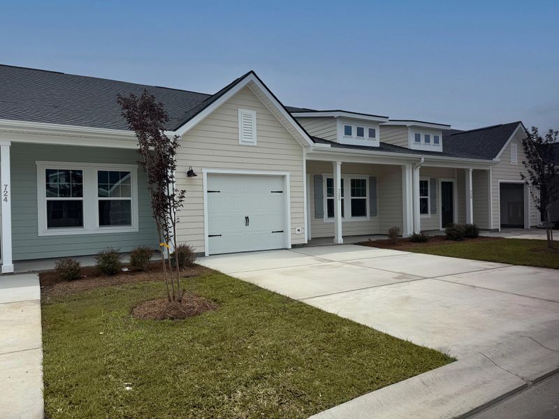 Front exterior of a new home in Blue Heron Retreat, Little River, SC, highlighting curb appeal (Image 2). Front exterior of a new home in Blue Heron Retreat, Little River, SC, highlighting curb appeal (Image 2).