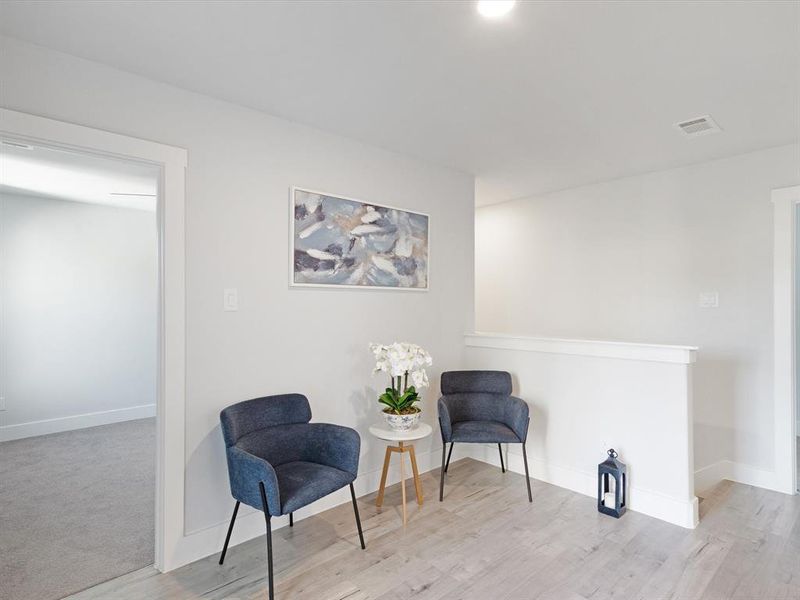 Living area with light wood-type flooring