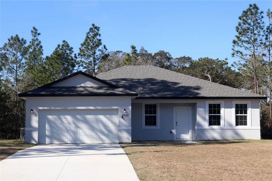 Front exterior of a new home in , Citrus Springs, FL, highlighting curb appeal (Image 22).