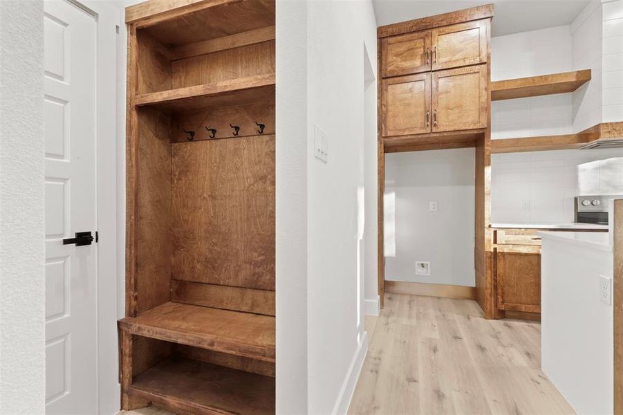 Mudroom featuring light wood-type flooring