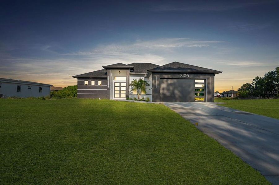 Front exterior of a new home in , Lehigh Acres, FL, highlighting curb appeal (Image 23).