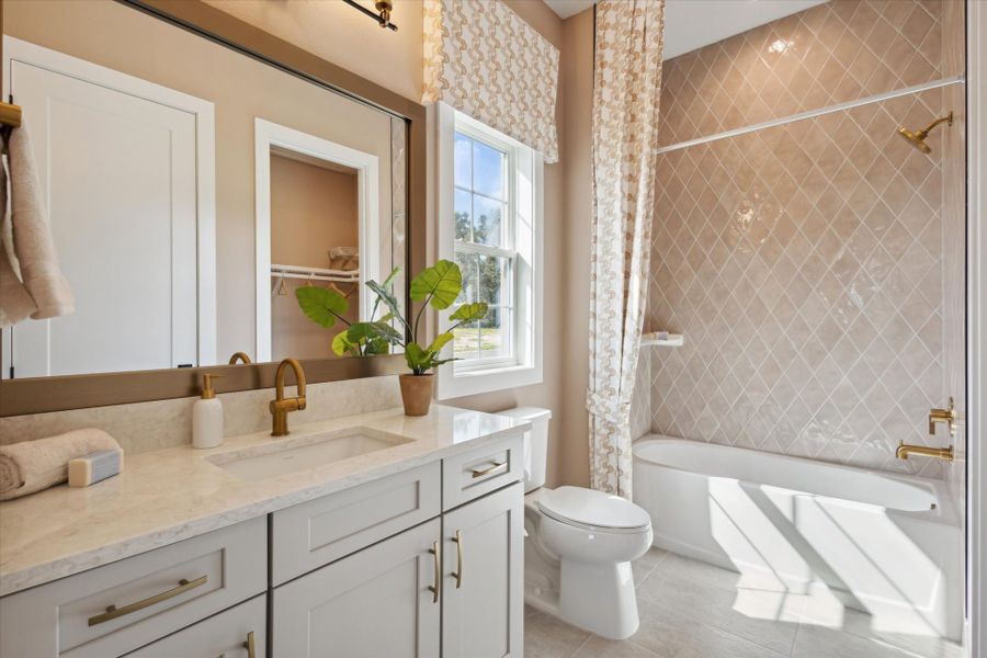 Representative furnished interior of a home built from the Cedar Key II by Homes by WestBay in Oakfield, Parrish (Image 23).