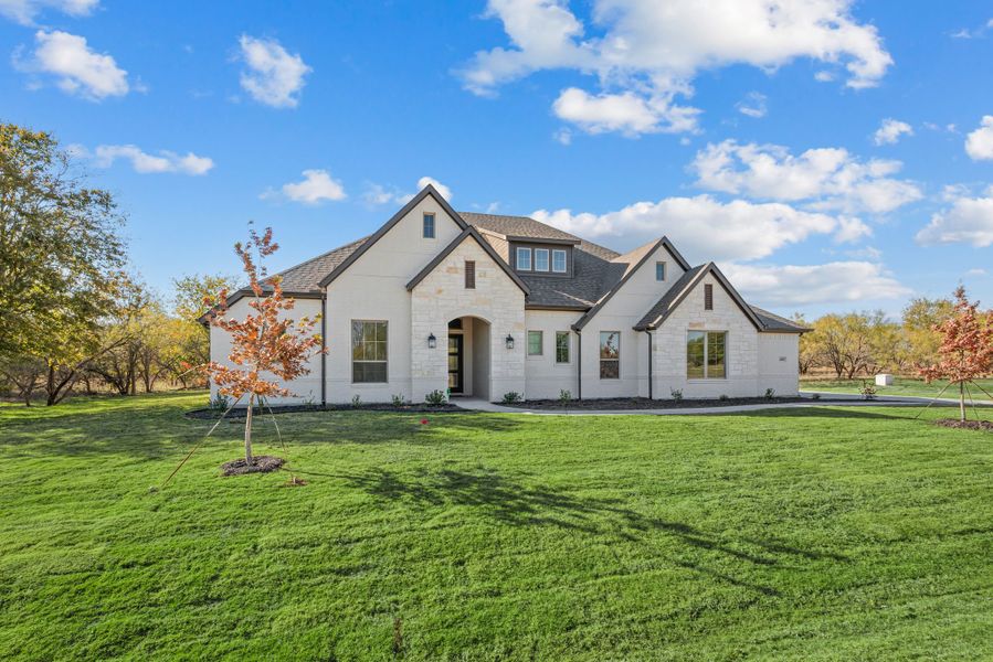 Front exterior of a new home in Rolling Creek Ranch, Aledo, TX, highlighting curb appeal (Image 30). Front exterior of a new home in Rolling Creek Ranch, Aledo, TX, highlighting curb appeal (Image 30).