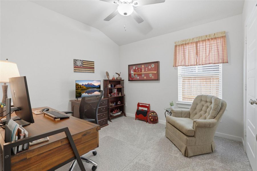 One of three spacious and versatile secondary bedrooms. This bedroom is being used as a home office.