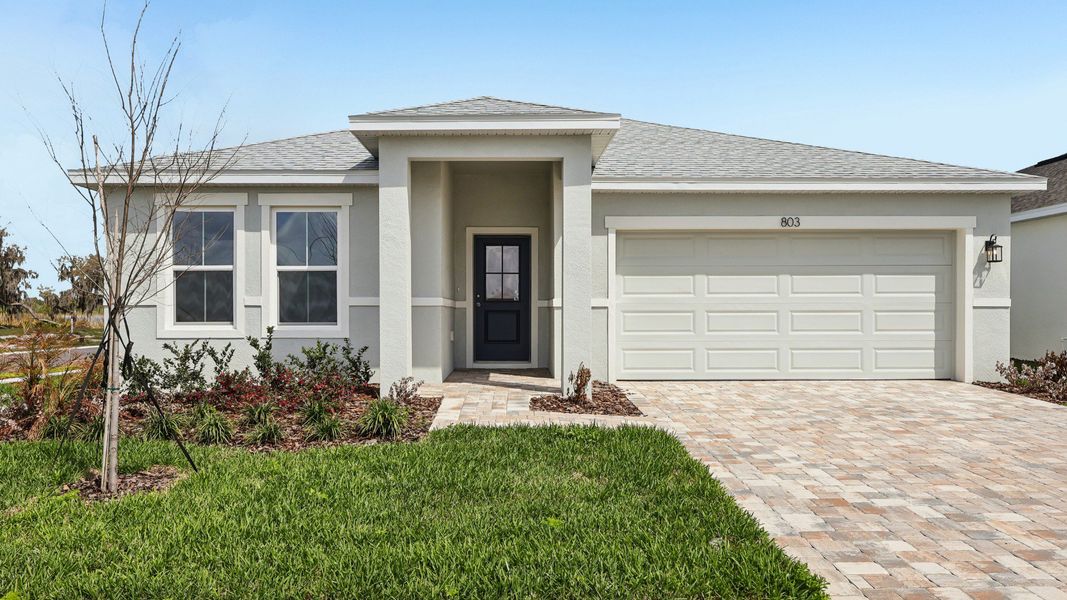 Representative exterior photo of a completed home built from the Castaway Multi-Gen by DRB Homes in Hamilton Bluff, Haines City, FL (Image 21).