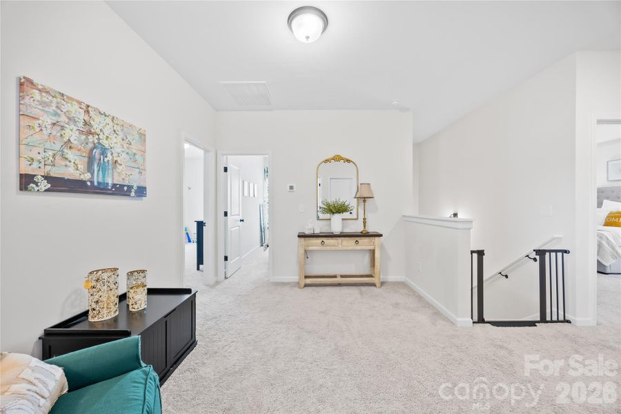 Furnished interior view inside a new home in Orchard Creek, Charlotte (Image 33).