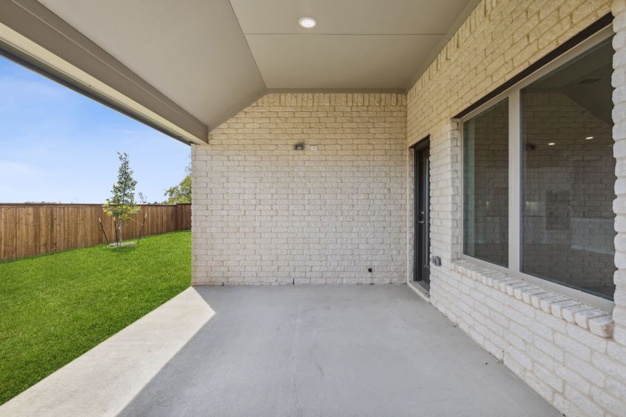 Covered Patio in the Bowie home plan by Trophy Signature Homes – REPRESENTATIVE PHOTO