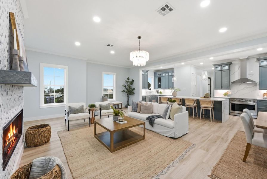 A spacious floorplan with a seamless flow between the living room, dining area, and kitchen—perfect for entertaining or relaxing with family.