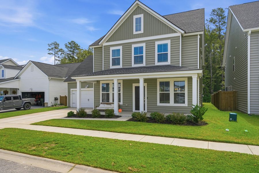 Front exterior of a new home in Sweetgrass at Summers Corner, Summerville, SC, highlighting curb appeal (Image 31). Front exterior of a new home in Sweetgrass at Summers Corner, Summerville, SC, highlighting curb appeal (Image 31).