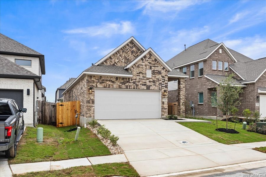 Front exterior of a new home in Legacy at Lake Dunlap, New Braunfels, TX, highlighting curb appeal (Image 18).