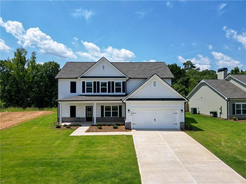 Front exterior of a new home in Harmony Farms, Eatonton, GA, highlighting curb appeal (Image 27).
