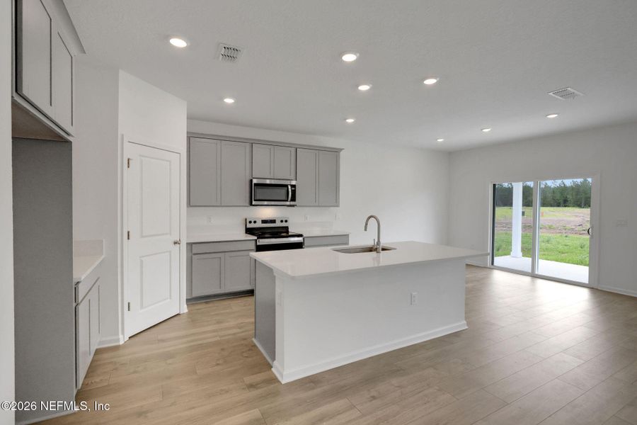 Furnished interior view inside a new home in Amberly, Green Cove Springs (Image 10).