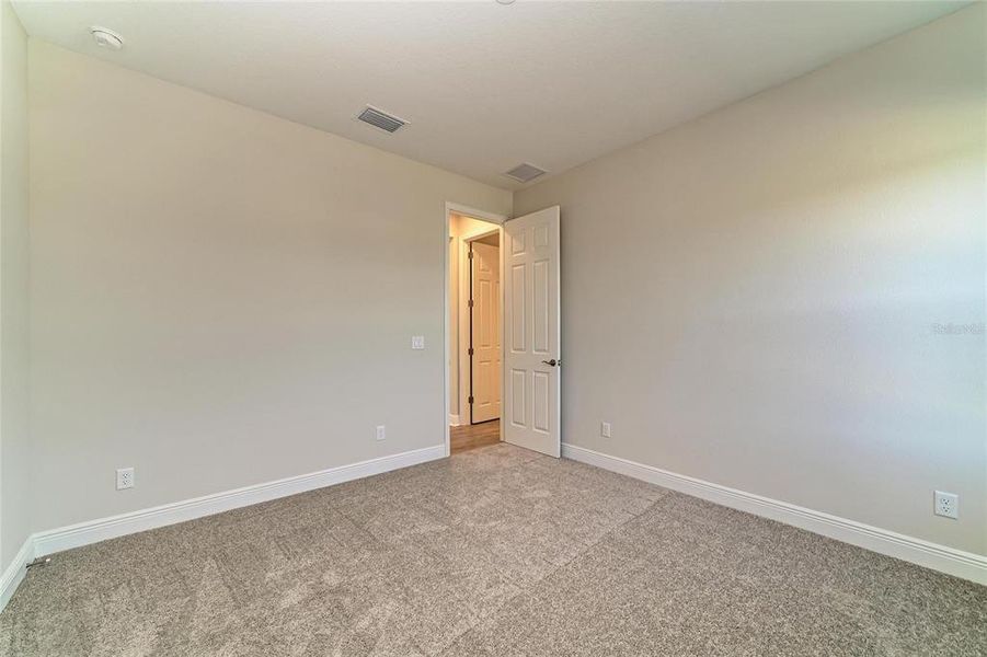 Spacious, unfurnished interior of a new home in Pasadena Woods, Wesley Chapel (Image 40).