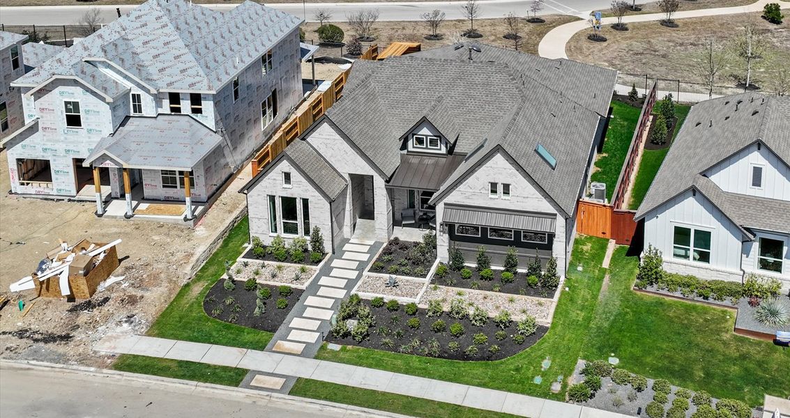 Representative exterior photo of a completed home built from the Malia by Chesmar Homes in Sunfield, Buda, TX (Image 19).