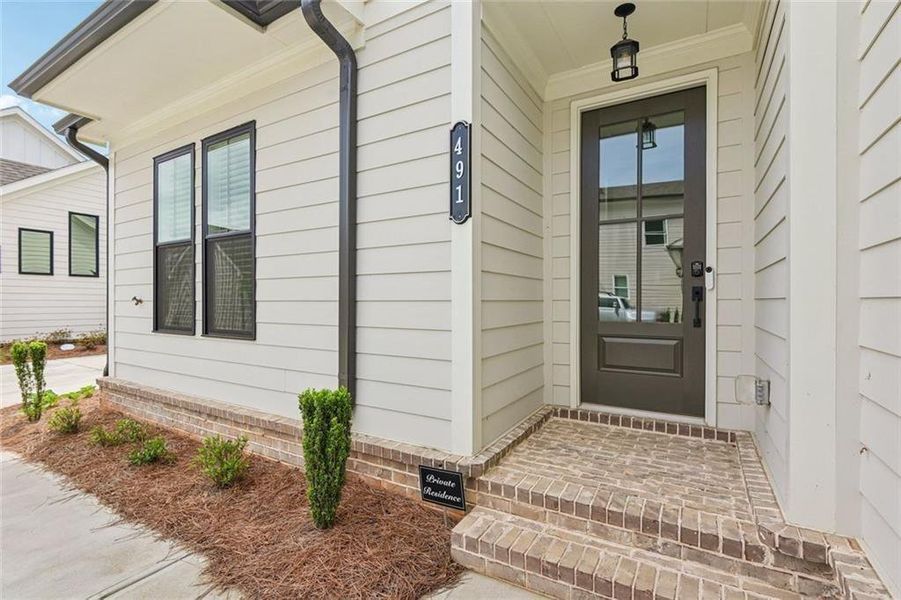 Exterior details and patio area of a home in Promenade at Sawnee Village, Cumming (Image 28). Exterior details and patio area of a home in Promenade at Sawnee Village, Cumming (Image 28).