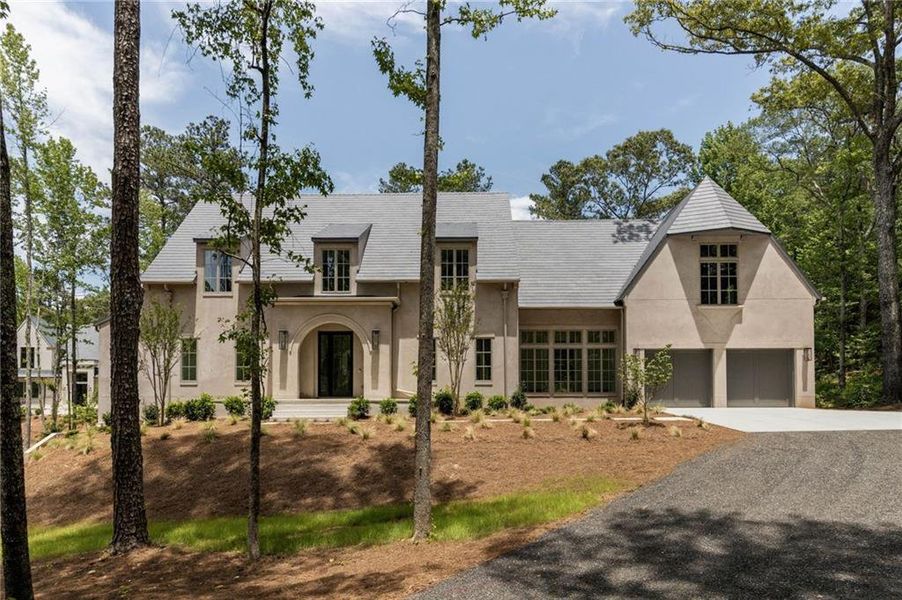 Front exterior of a new home in , Chattahoochee Hills, GA, highlighting curb appeal (Image 2). Front exterior of a new home in , Chattahoochee Hills, GA, highlighting curb appeal (Image 2).
