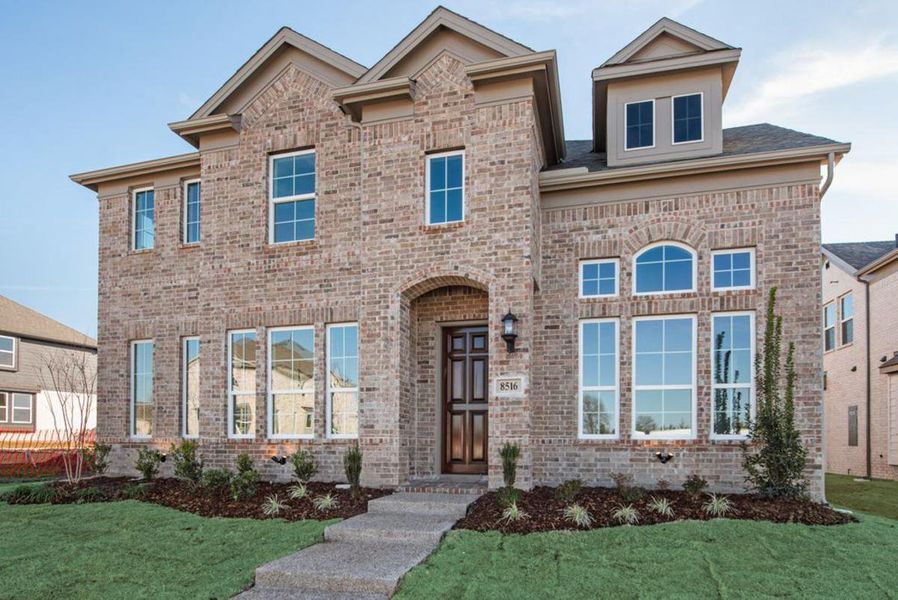 Representative exterior photo of a completed home built from the Royal Oak by Grand Homes in Edgewater, Fate, TX (Image 15). Representative exterior photo of a completed home built from the Royal Oak by Grand Homes in Edgewater, Fate, TX (Image 15).