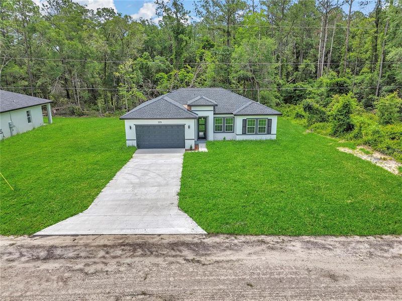 Front exterior of a new home in , Dunnellon, FL, highlighting curb appeal (Image 19).