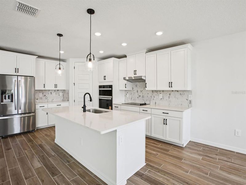 Furnished interior view inside a new home in Two Rivers - Signature Series, Zephyrhills (Image 12). Furnished interior view inside a new home in Two Rivers - Signature Series, Zephyrhills (Image 12).