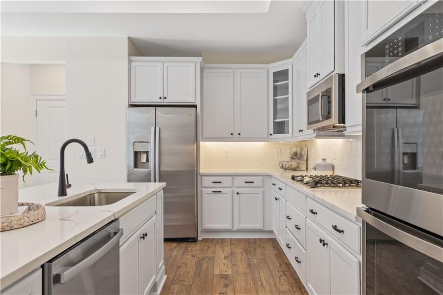 Furnished interior in a model home at The Courtyards by The Manor in Alpharetta (Image 7).