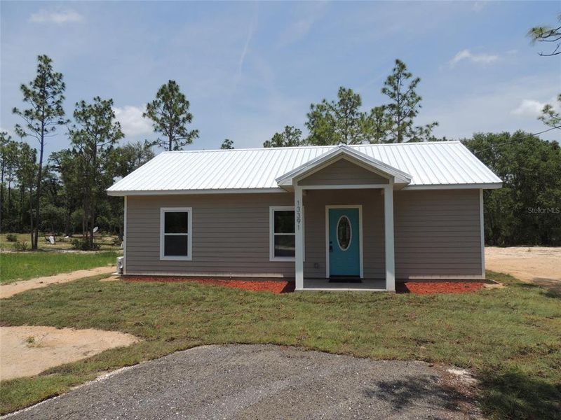 Front exterior of a new home in , Williston, FL, highlighting curb appeal (Image 15). Front exterior of a new home in , Williston, FL, highlighting curb appeal (Image 15).