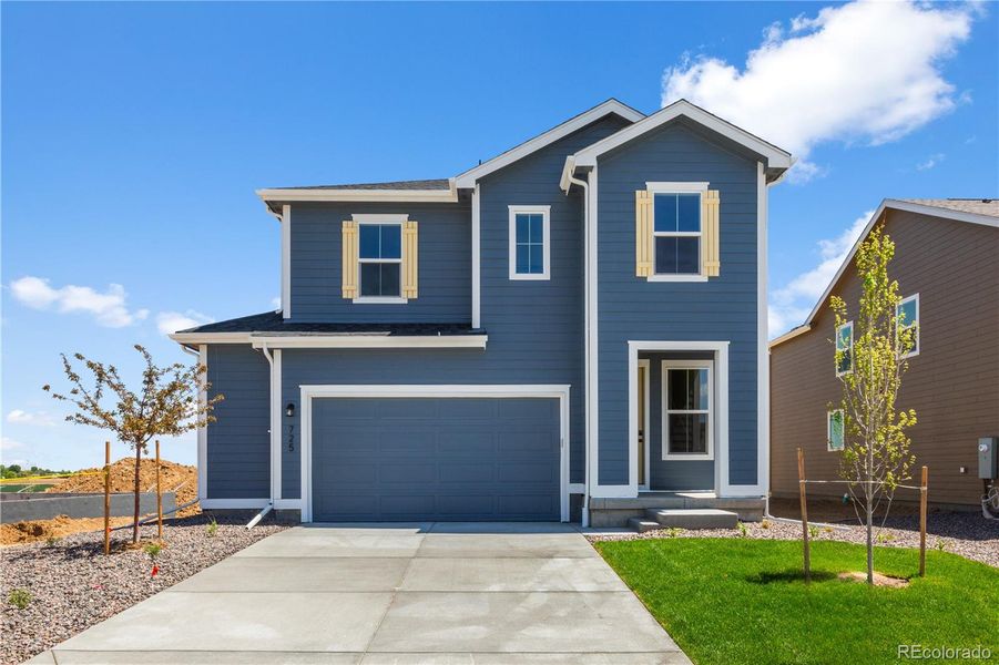 Front exterior of a new home in Granary, Johnstown, CO, highlighting curb appeal (Image 13). Front exterior of a new home in Granary, Johnstown, CO, highlighting curb appeal (Image 13).