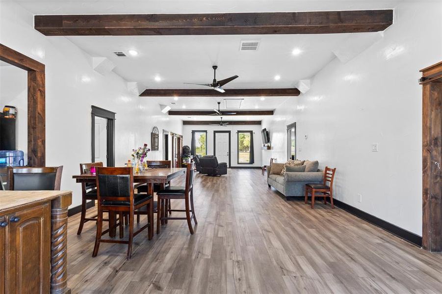 Dining area featuring light wood-style flooring, beam ceiling, recessed lighting, and a ceiling fan Dining area featuring light wood-style flooring, beam ceiling, recessed lighting, and a ceiling fan