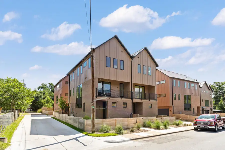 Striking contemporary architecture showcases board and batten siding combined with brick accents. Striking contemporary architecture showcases board and batten siding combined with brick accents.