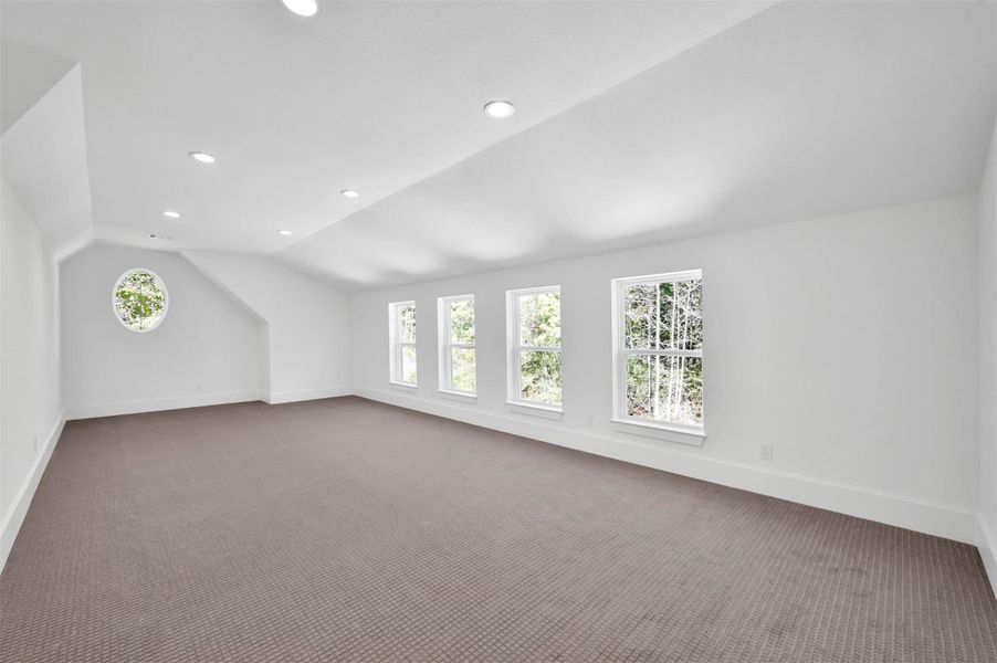 Spacious flex room has expansive windows. Spacious flex room has expansive windows.