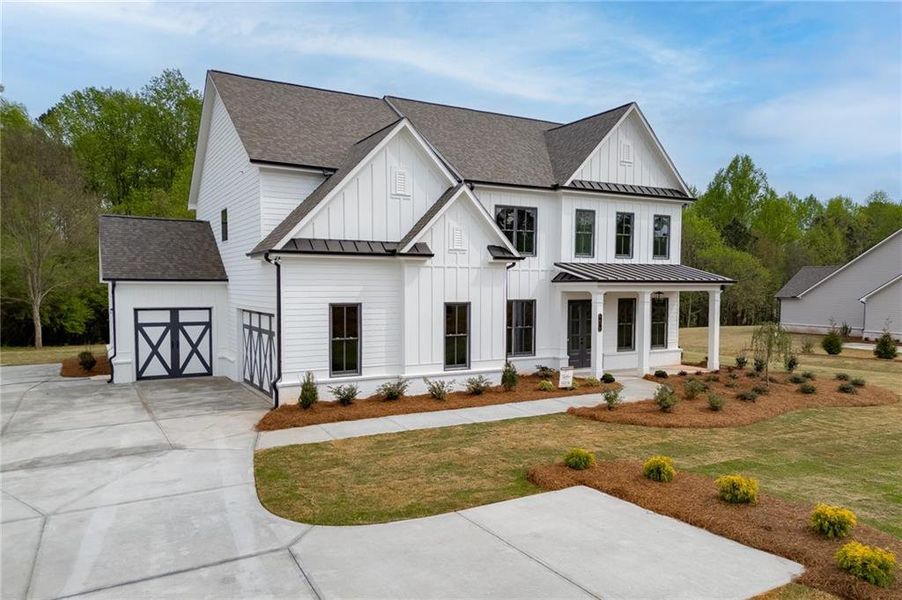 Front exterior of a new home in , Cumming, GA, highlighting curb appeal (Image 2). Front exterior of a new home in , Cumming, GA, highlighting curb appeal (Image 2).