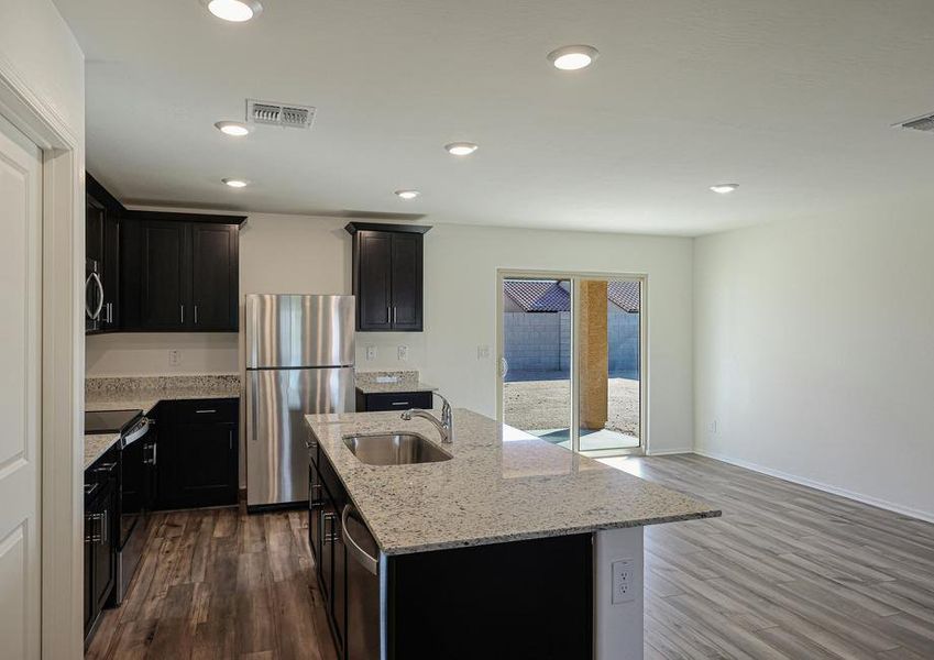 The kitchen opens up to the backyard patio.