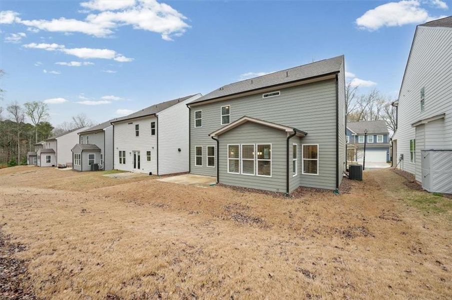 Exterior details and patio area of a home in Enclave at Edgewater, Holly Springs (Image 32).