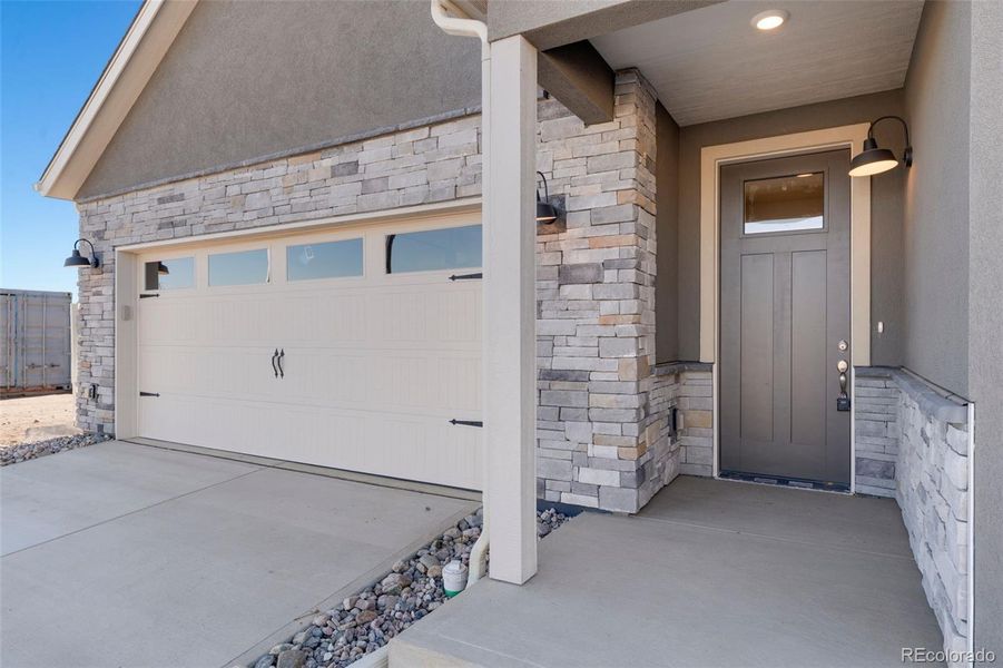 Exterior details and patio area of a home in The Courtyards at Lupton Village, Fort Lupton (Image 20).