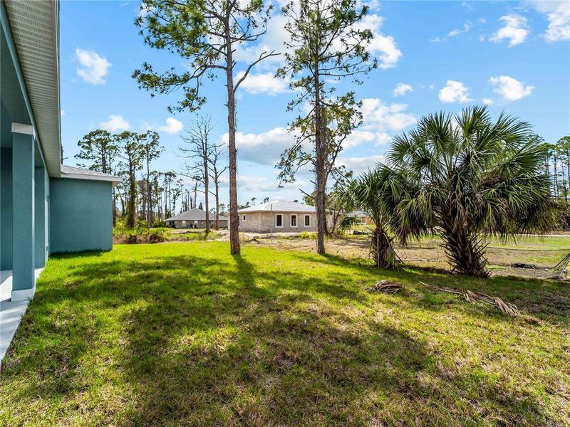 Exterior details and patio area of a home in , North Port (Image 25).