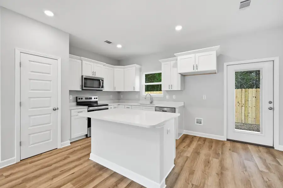 Furnished interior view inside a new home in Live Oak Cottages, Freeport (Image 9).