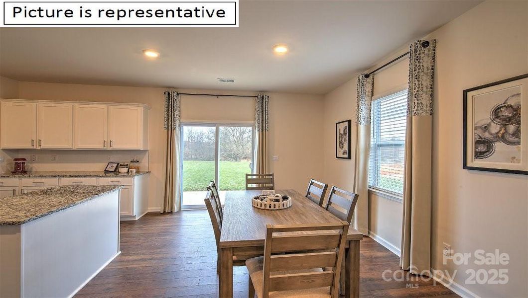 Breakfast area with kitchen and patio doors