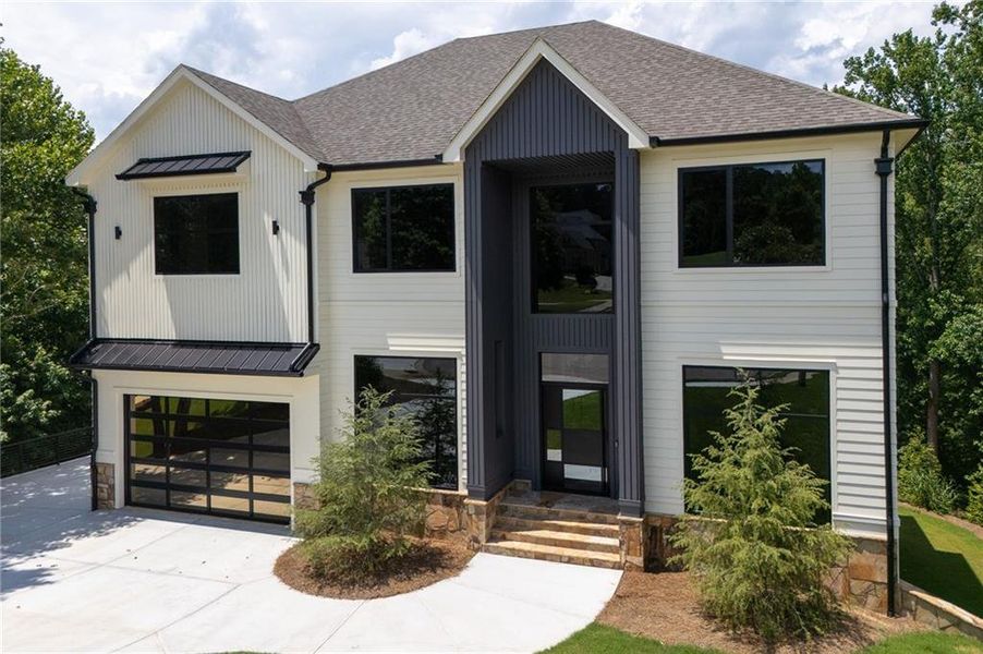 Front exterior of a new home in , Milton, GA, highlighting curb appeal (Image 27). Front exterior of a new home in , Milton, GA, highlighting curb appeal (Image 27).