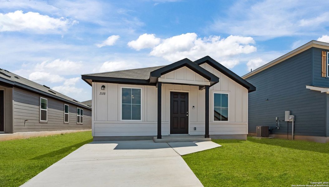 Front exterior of a new home in Vista Real, Converse, TX, highlighting curb appeal (Image 2).