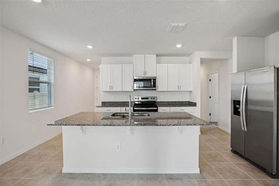 Furnished interior view inside a new home in Villamar - Classic Series, Winter Haven (Image 12).