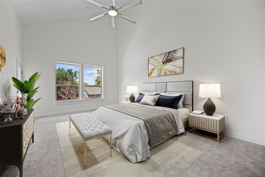 Carpeted bedroom with high vaulted ceiling and ceiling fan