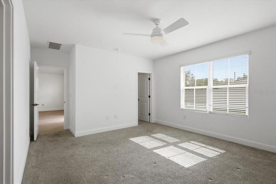 Spacious, unfurnished interior of a new home in Aspire at Palm Coast, Palm Coast (Image 32).