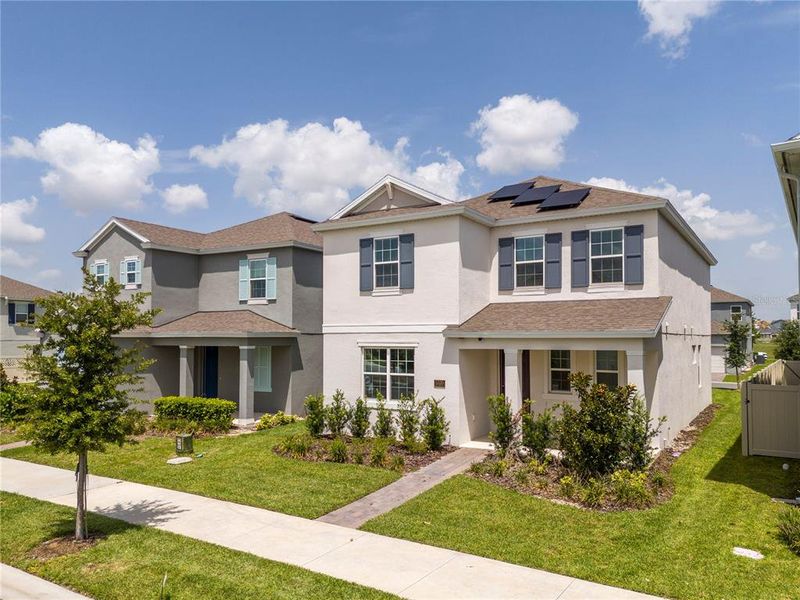Front exterior of a new home in , Winter Garden, FL, highlighting curb appeal (Image 28). Front exterior of a new home in , Winter Garden, FL, highlighting curb appeal (Image 28).