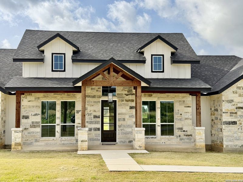 Front exterior of a new home in , Floresville, TX, highlighting curb appeal (Image 1). Front exterior of a new home in , Floresville, TX, highlighting curb appeal (Image 1).