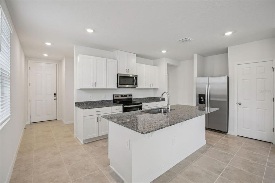 Furnished interior view inside a new home in Villamar - Classic Series, Winter Haven (Image 8).